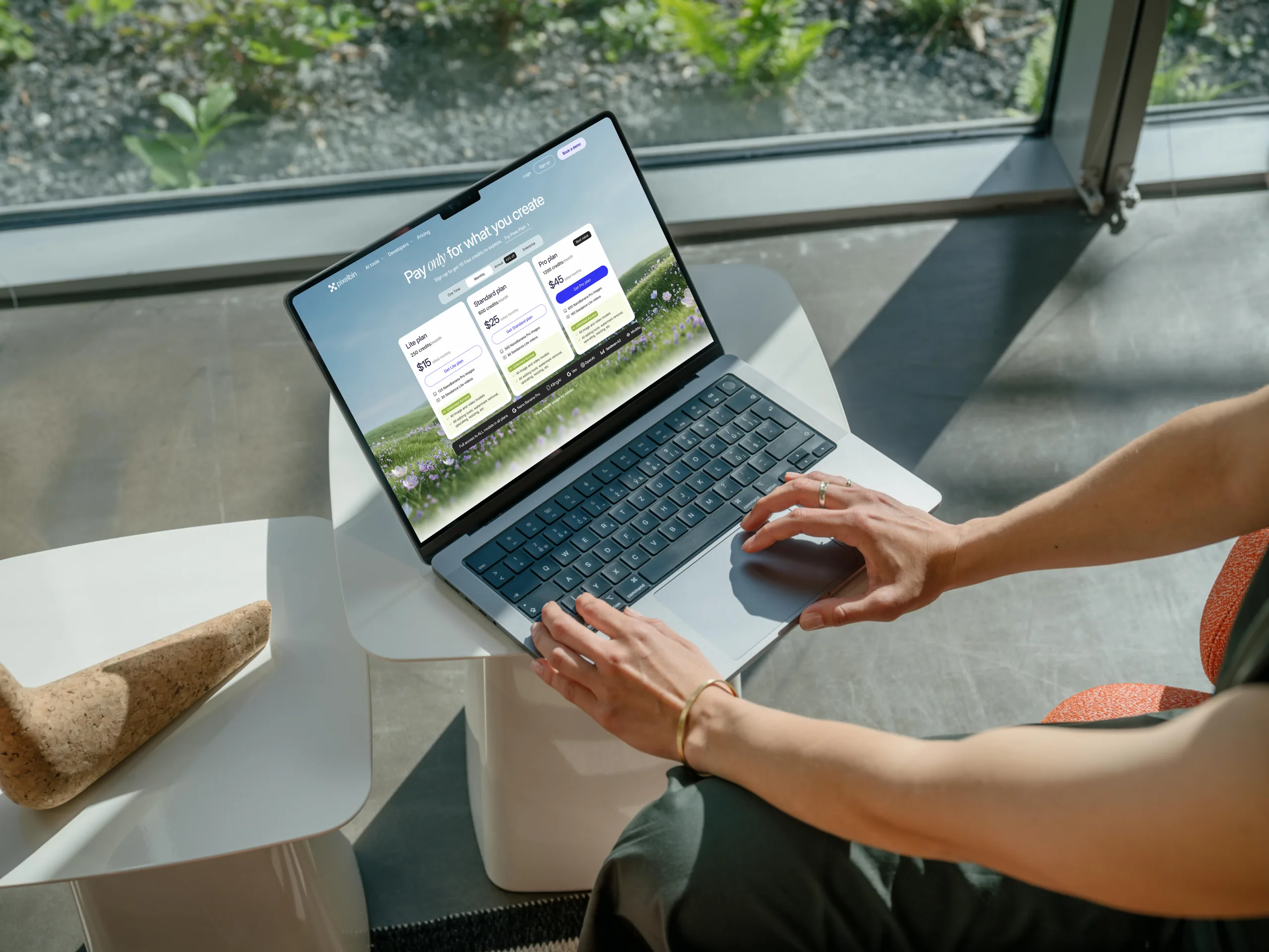 PixelBin pricing redesign — MacBook Pro showing the checkout experience